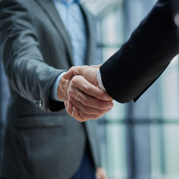 Handshake in office - meeting your certification needs