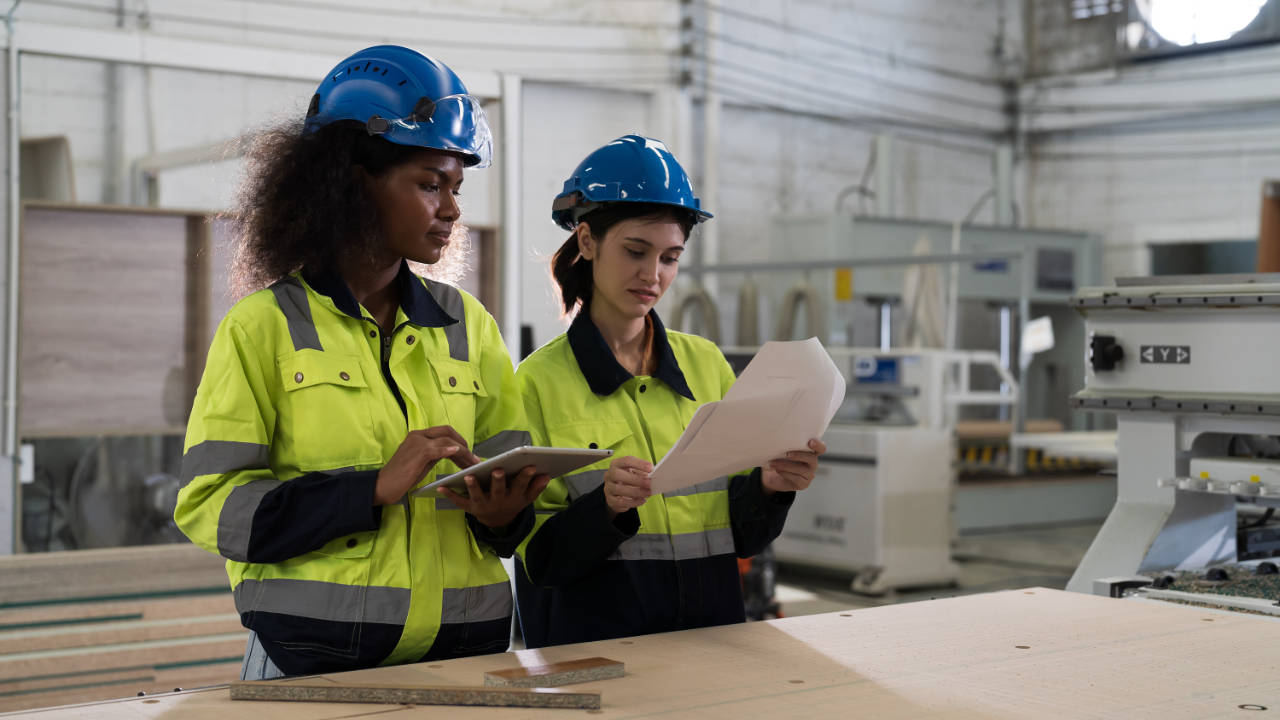 quality policy examples - workers in a factory assessing a quality policy